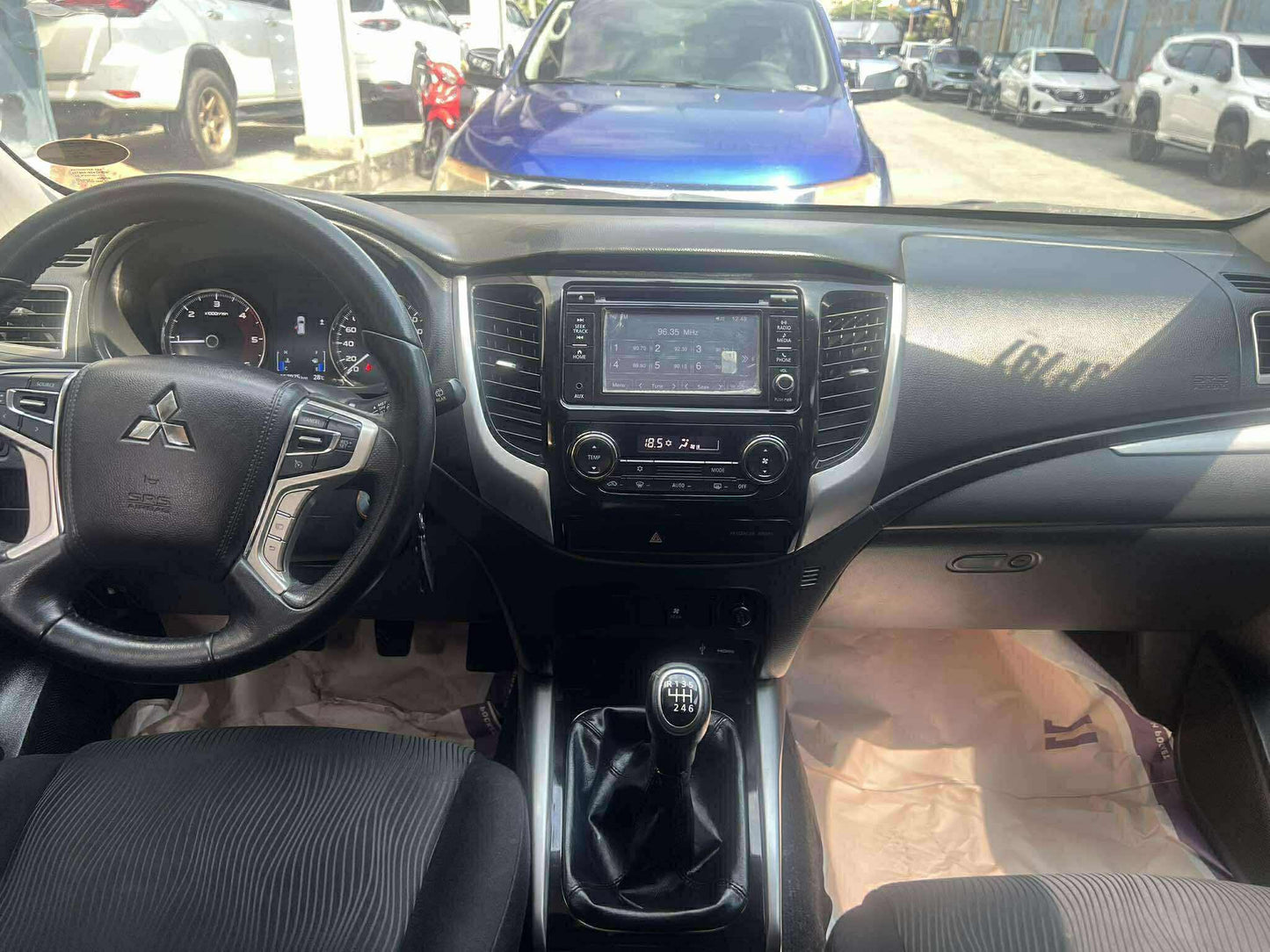 2017 MITSUBISHI MONTERO &nbsp;GLX 2.4L DSL MANUAL TRANSMISSION Gold Aces Car Display Center